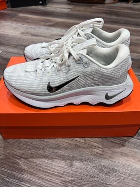 Women’s Nike Motiva Premium Gray Sneakers with Chrome Swoosh.